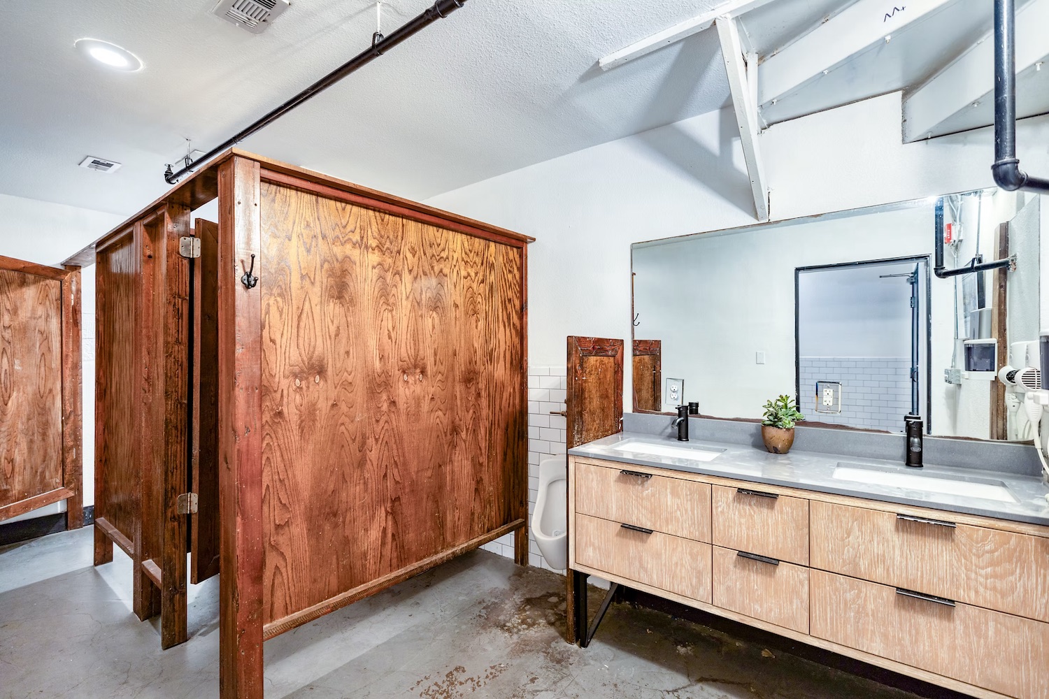 Firehouse Hostel dorm room with custom bunk beds and warm lighting