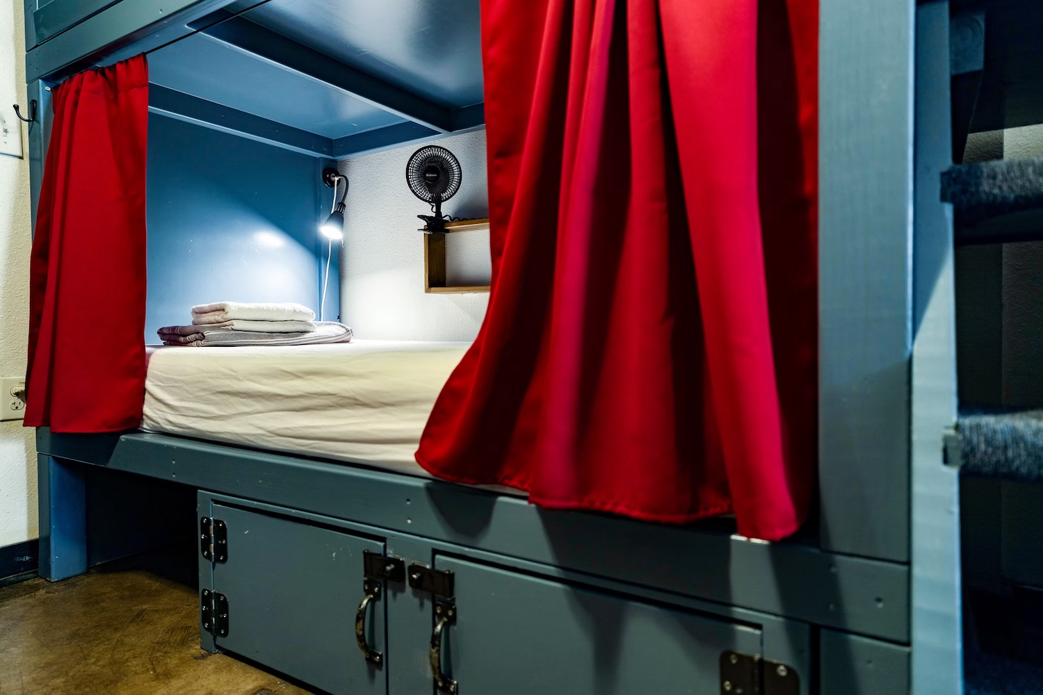 Built-in lockers and individual power outlets at each bunk