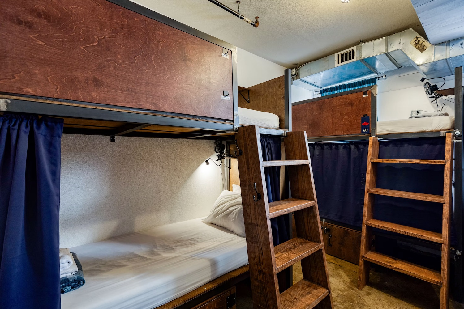 Neatly made bunk beds in the dorm room