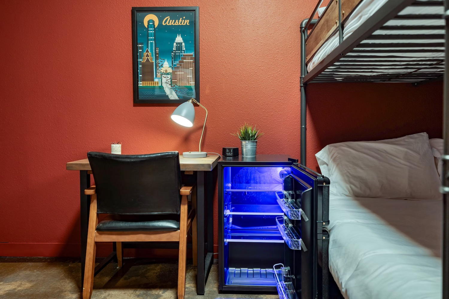 Private room with queen bed and warm bedside lighting