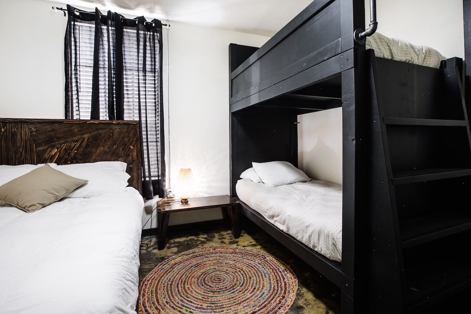 Suite vanity and mirror with wall-mounted lighting