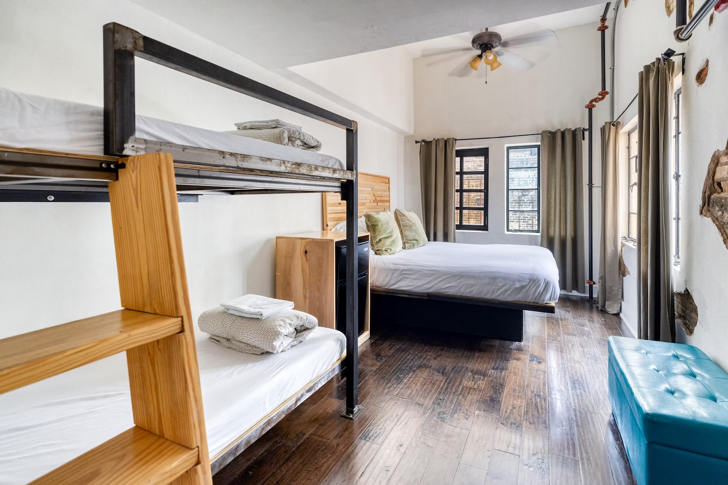 Firehouse Hostel suite with king bed and sitting area